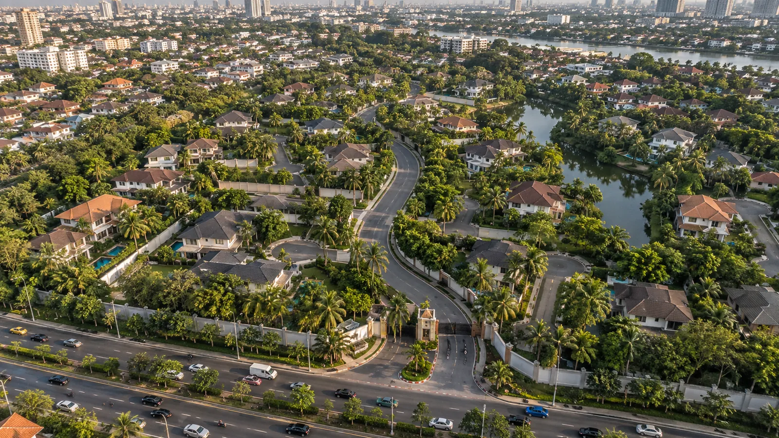 From above, a gated housing estate of winding cul-de-sacs, its single gate opening onto a busy arterial road