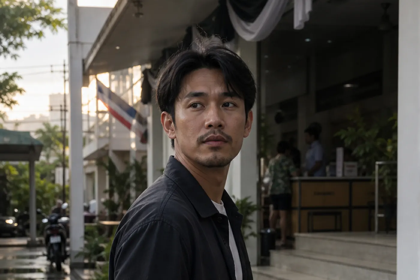 A man pauses outside a district office