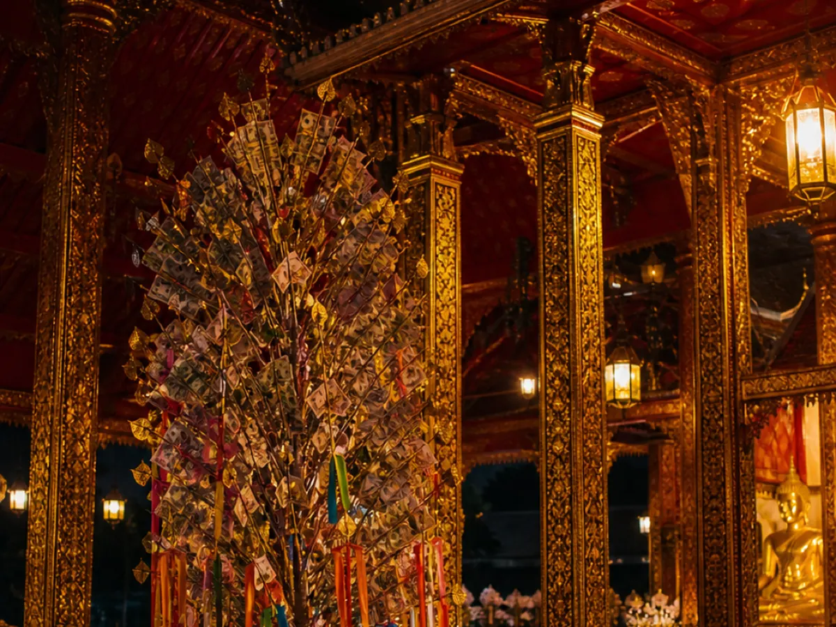 A money tree of banknotes inside a temple hall